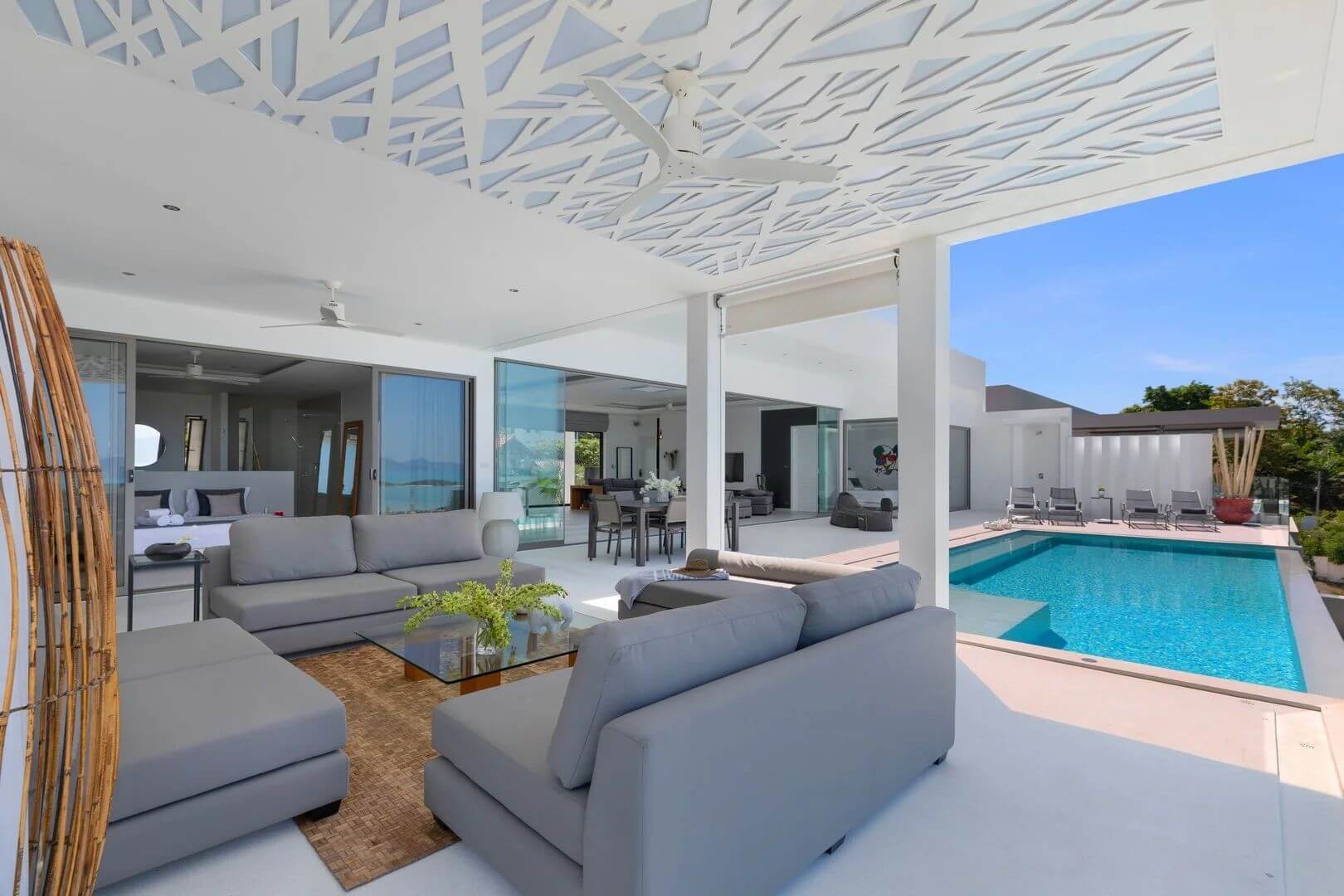 The sala's sculpted white canopy over the lounge, the pool alongside.